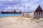 Ruin with vessel in the background