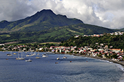 The city of Saint Pierre with  Mount  Pelee in the back